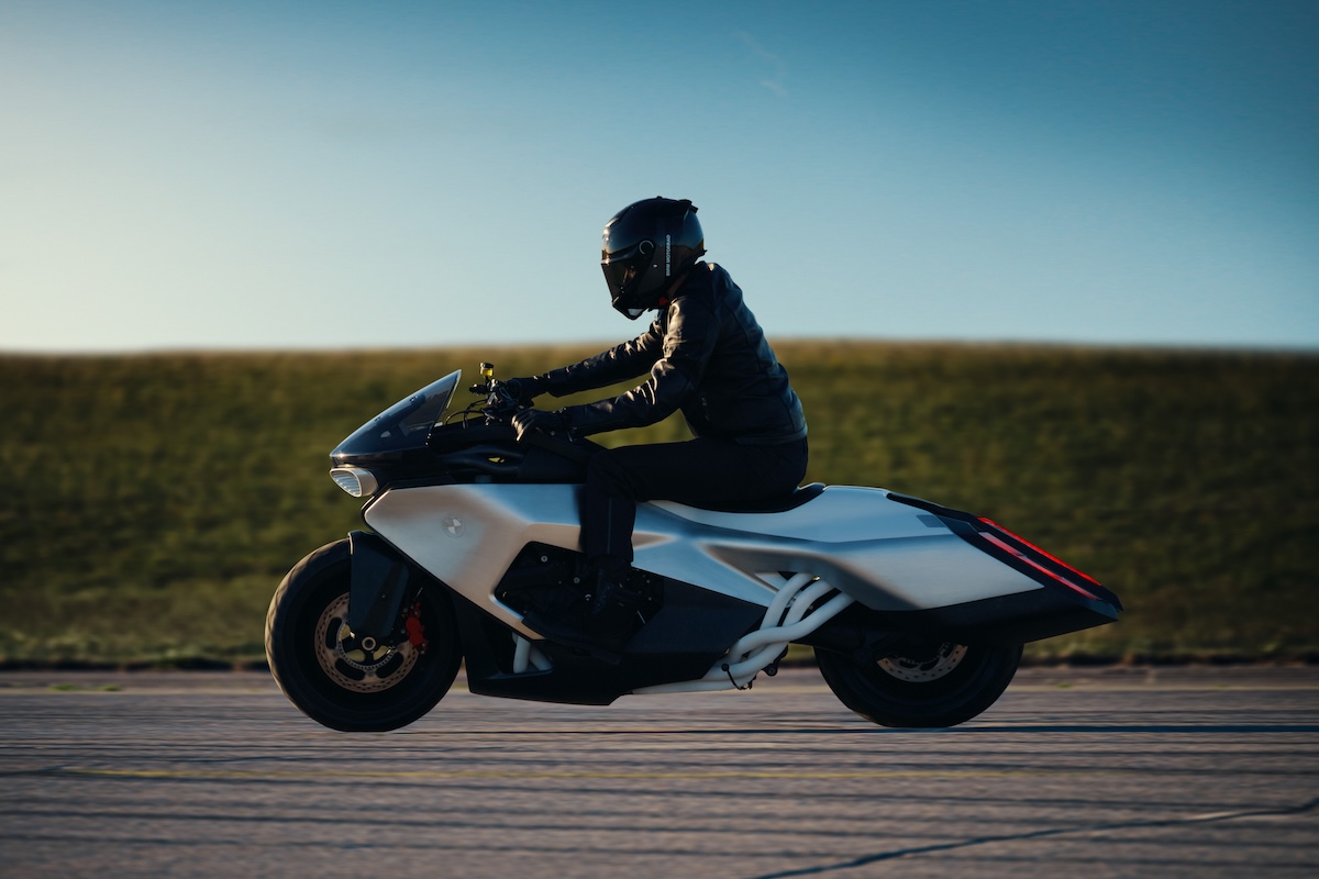 BMW Motorrad Vision K18 ridden at speed showing flat rear line and hand-formed bodywork in motion
