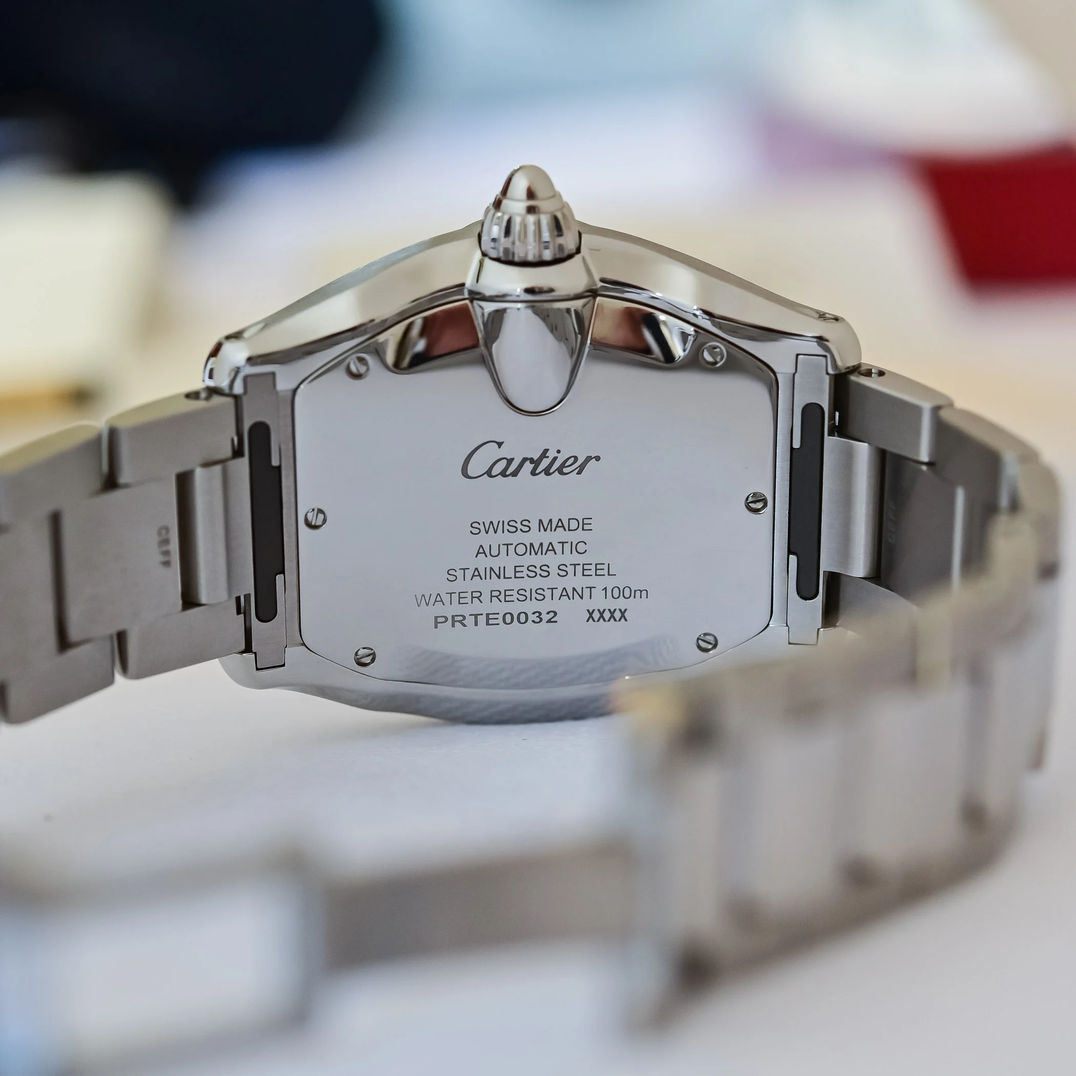 Cartier Roadster caseback showing Swiss Made automatic engraving