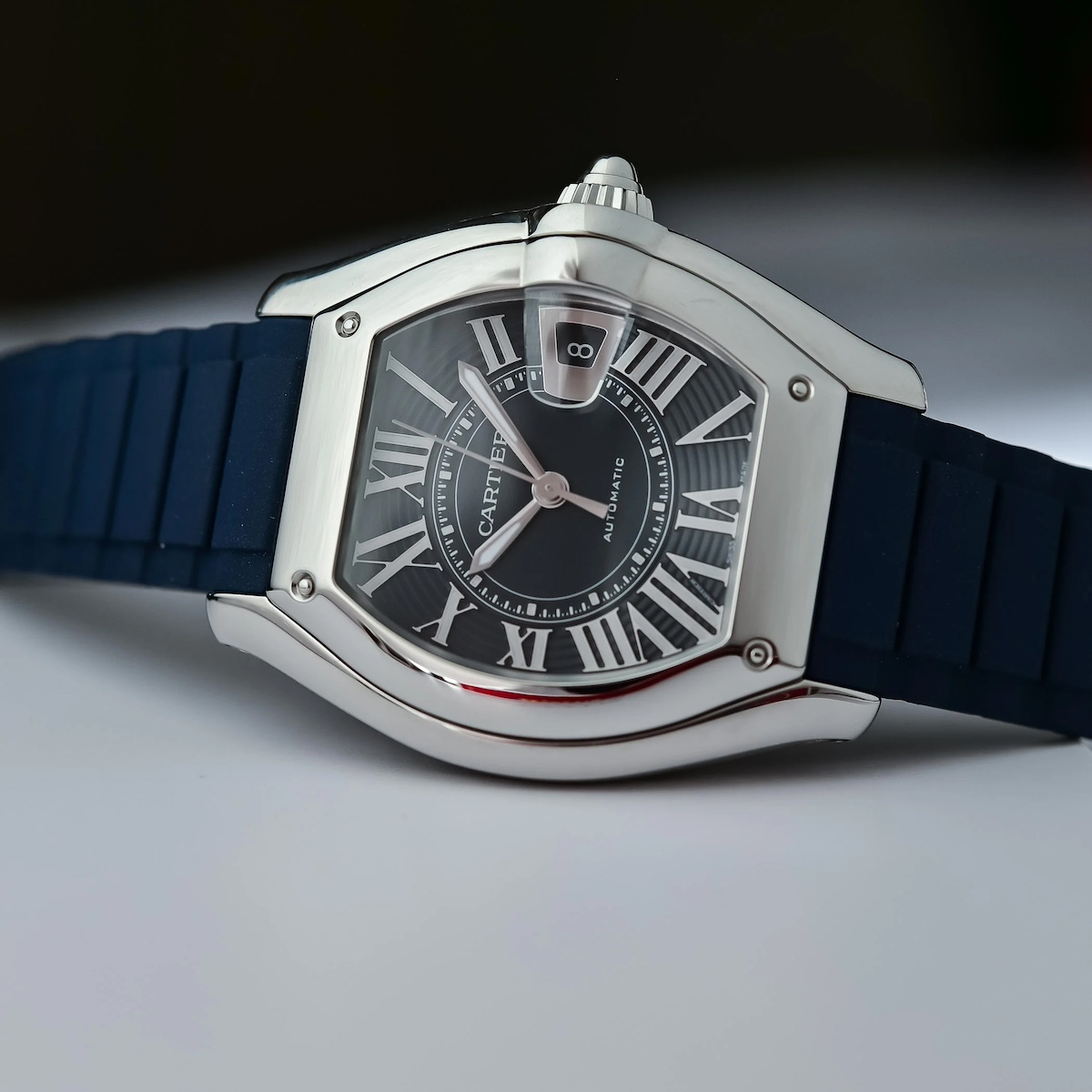 Cartier Roadster bezel detail with rivets and integrated crown