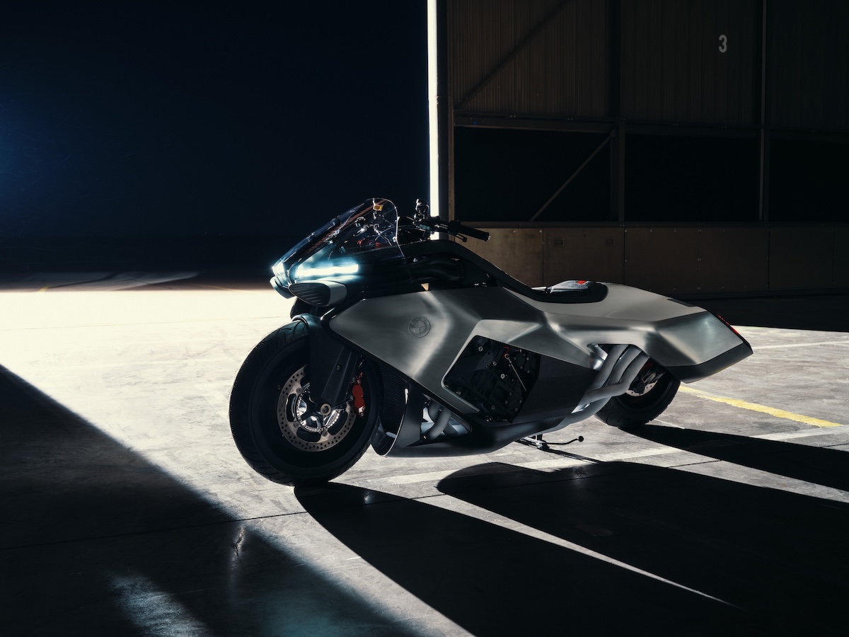 BMW Motorrad Vision K18 in hangar setting showing Concorde-inspired hand-planished aluminum bodywork