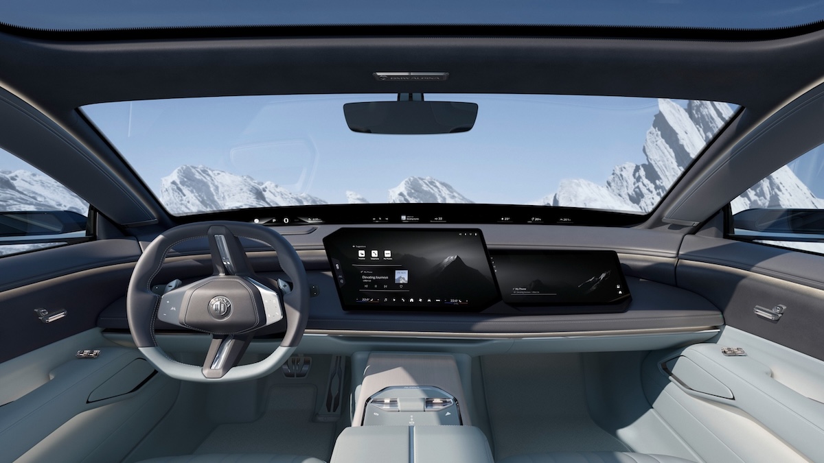 Vision BMW ALPINA interior showing BMW Panoramic iDrive ALPINA UI dashboard and Alpine mountain backdrop through windscreen